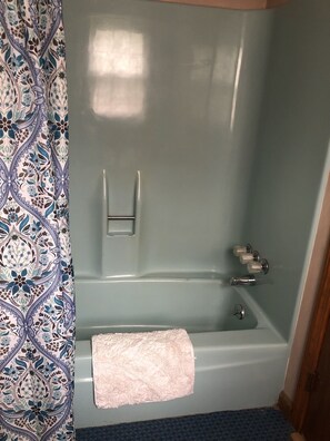 Bathtub, hair dryer, towels