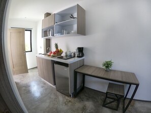 Enjoy cooking in this well-lit kitchen with a dishwasher and dining area.
