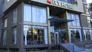 A multi-story hotel with a prominent sign reading "IVY HOTEL". - Ivy Hotel Addis Ababa (Addis Ababa)