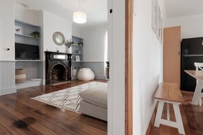 TV, fireplace, books