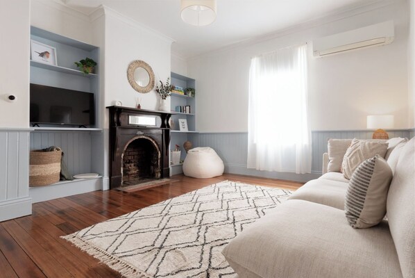 TV, fireplace, books