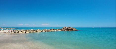 On the beach, sun loungers