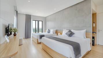 Family Quadruple Room, 2 Queen Beds | Minibar, desk, soundproofing, iron/ironing board