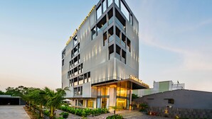A modern hotel with a prominent entrance, multiple floors, and a well-lit facade. - Thuan Hue Boutique Hotel - Nam Hoi An (Da Nang)