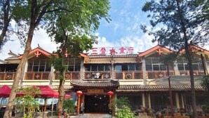 A traditional building with a tiled roof and a sign in a foreign language. - Tiandi Renhe Inn (Shilin)