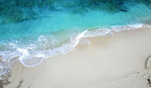 On the beach, sun loungers, beach towels