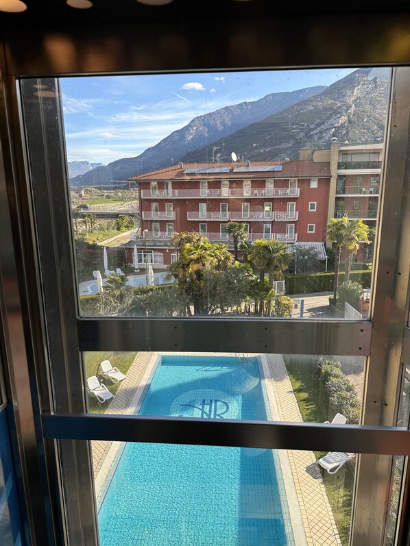 Seasonal outdoor pool, open 9:00 AM to 7:00 PM, pool loungers