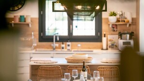 A modern kitchen with a dining area. - Villa Margot, stunning pool, beach 500 m (Agde)