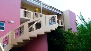 A multi-level residential building with a beige staircase and balconies. - Mediterranean Sea Top Floor (Kantanos-Selino)