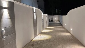 A nighttime corridor with tiled flooring and illuminated walls. - MELOGRANO apartment near sandy beach (Campomarino)