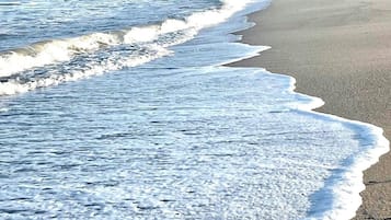 On the beach, sun-loungers, beach towels