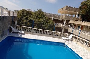 Outdoor pool, open 10:00 AM to 10:00 PM, sun loungers
