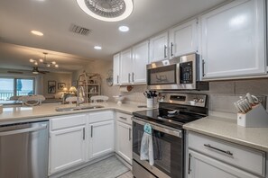 Enjoy cooking in this well-equipped kitchen with a dishwasher, oven, and microwave.