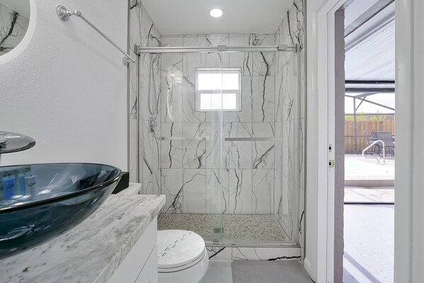 Shower, hair dryer, towels, soap