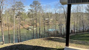 A view of a lake with trees and a dock. - 4 Bedroom 3 Bath Lakefront Home with Private Dock, Secluded, Lewis Smith Lake (Double Springs)