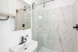 Shower, hair dryer, towels, soap
