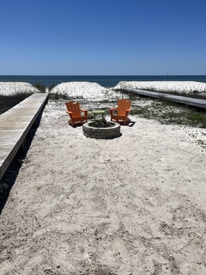 On the beach, sun-loungers