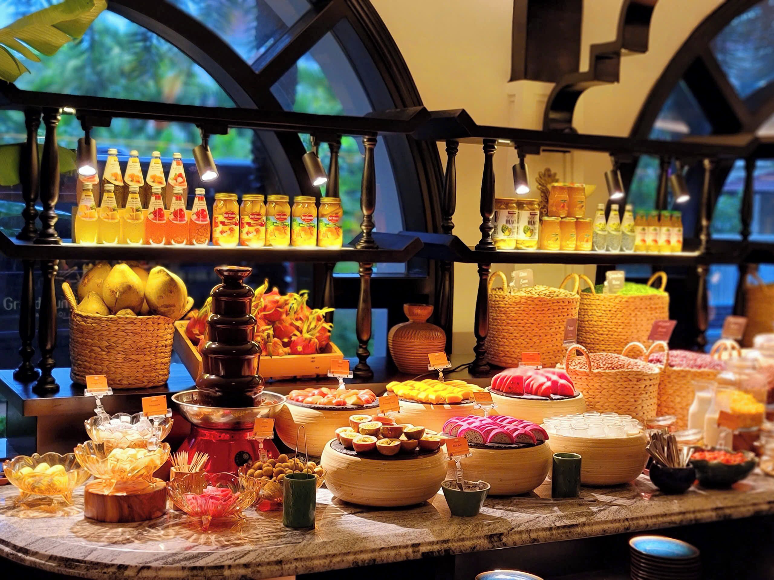 A buffet with various food items and condiments.