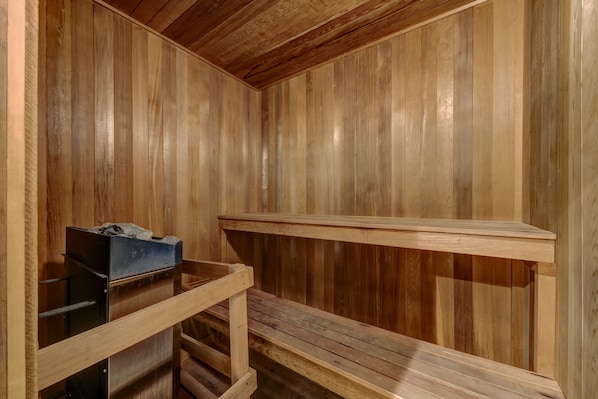 A sauna room with wooden walls and benches. - Telemark 8 - Ski in Walk out, Private Sauna, Short Walk to the Village (Whistler)