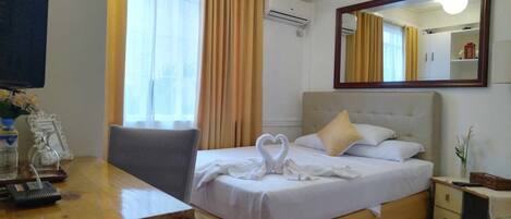 Premium bedding, down duvets, pillow-top beds, in-room safe