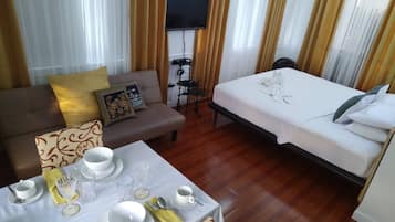 Habitación familiar | Ropa de cama de alta calidad y edredones de plumas