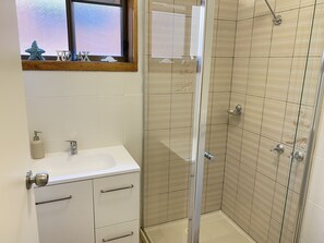Shower, hair dryer, towels, soap