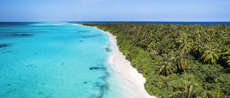 On the beach, white sand, beach towels