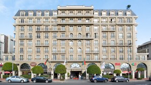 A large, multi-story hotel with a classic European architectural style, featuring symmetrical windows and a central entrance. - Cape Royale 213 (Cape Town)