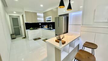 Premier Apartment, 3 Bedrooms | Private kitchen | Full-sized fridge, microwave, coffee/tea maker, electric kettle