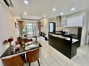 Family Apartment | Living area | 60-inch flat-screen TV with cable channels, TV, first-run movies - Convinia Apartment (Ho Chi Minh City)