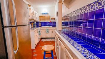 Fridge, microwave, oven, cookware/dishes/utensils