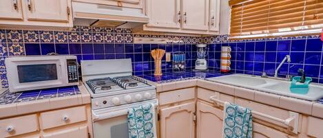 Fridge, microwave, oven, cookware/dishes/utensils