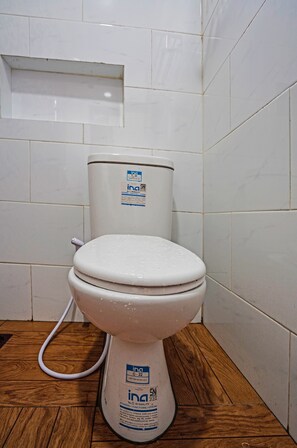 Shower, rainfall showerhead, towels, toilet paper