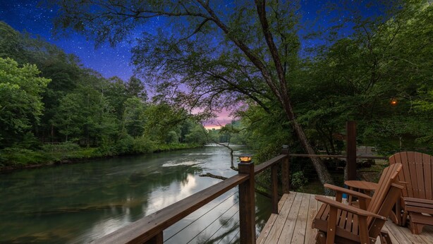 A wooden deck overlooking a river with a starry night sky. - The River's Edge (Blue Ridge)