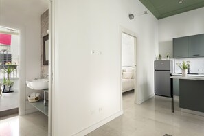 Departamento exclusivo, cocina | Área de sala de estar | Televisión de pantalla plana, Netflix y bocina smart 