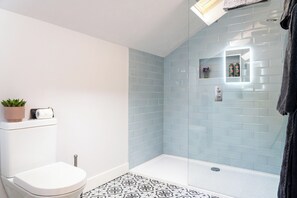 Shower, eco-friendly toiletries, hair dryer, towels