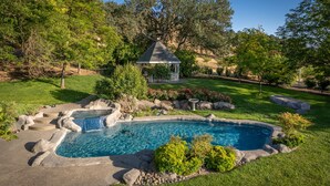 A backyard with a swimming pool, a gazebo, and a well-maintained lawn. - 20 Acres + Pool + Game Room | Paso Wine Country | Oaks and Roses Ranch (Paso Robles)