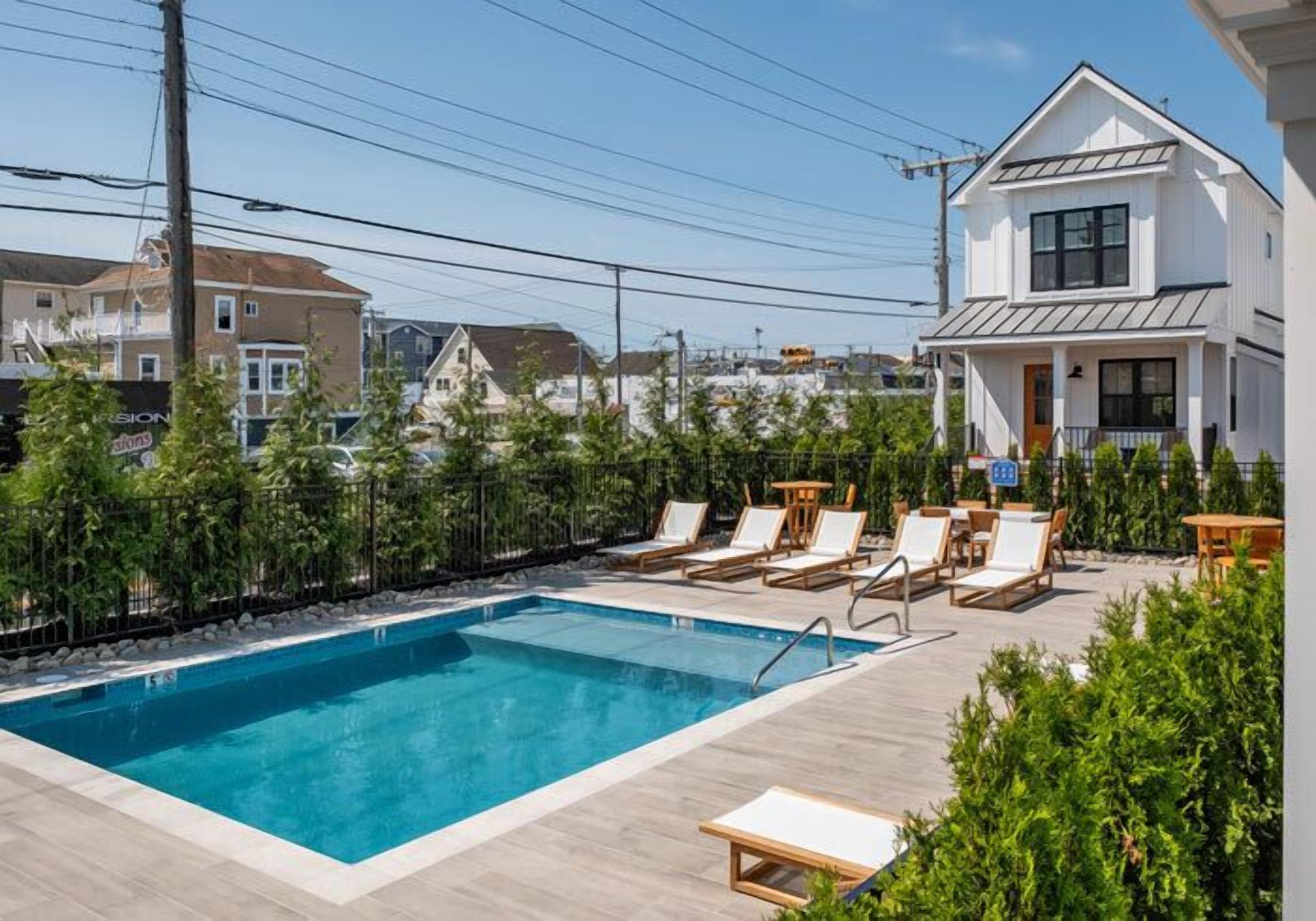 Seasonal outdoor pool, pool umbrellas, pool loungers