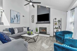 TV, fireplace - Spacious Olathe Home: Pool Table, WiFi & Theatre (Olathe)