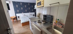 Fridge, microwave, stovetop, coffee/tea maker
