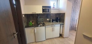 Fridge, microwave, stovetop, coffee/tea maker