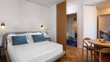 Premium bedding, down comforters, minibar, in-room safe