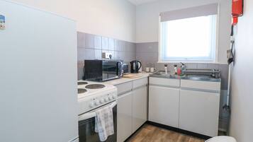 Fridge, electric kettle, toaster, cookware/dishes/utensils