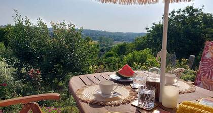 Holiday home in a picturesque landscape with a view and garden kitchen, wooden barrel with whirlpool and sauna