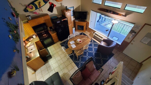 A compact kitchen with a dining area, a large window, and a view of the outside. - #106-Condo nearby pool and the Gorge shuttle stop (Quincy)