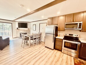 Fridge, microwave, oven, stovetop - Castle Rock Lakefront Home, with pier, sand bottom, and wrap around deck (Arkdale)