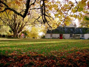 Exterior - A beautiful family cottage spilling out onto the big lawn and woodland.  (Nethy Bridge,)