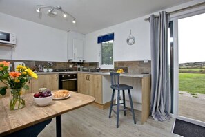 Enjoy cooking in this well-lit kitchen with a large island and sink.