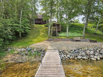 Three bedroom hide-a-way with spacious deck over looking Island Lake. 
