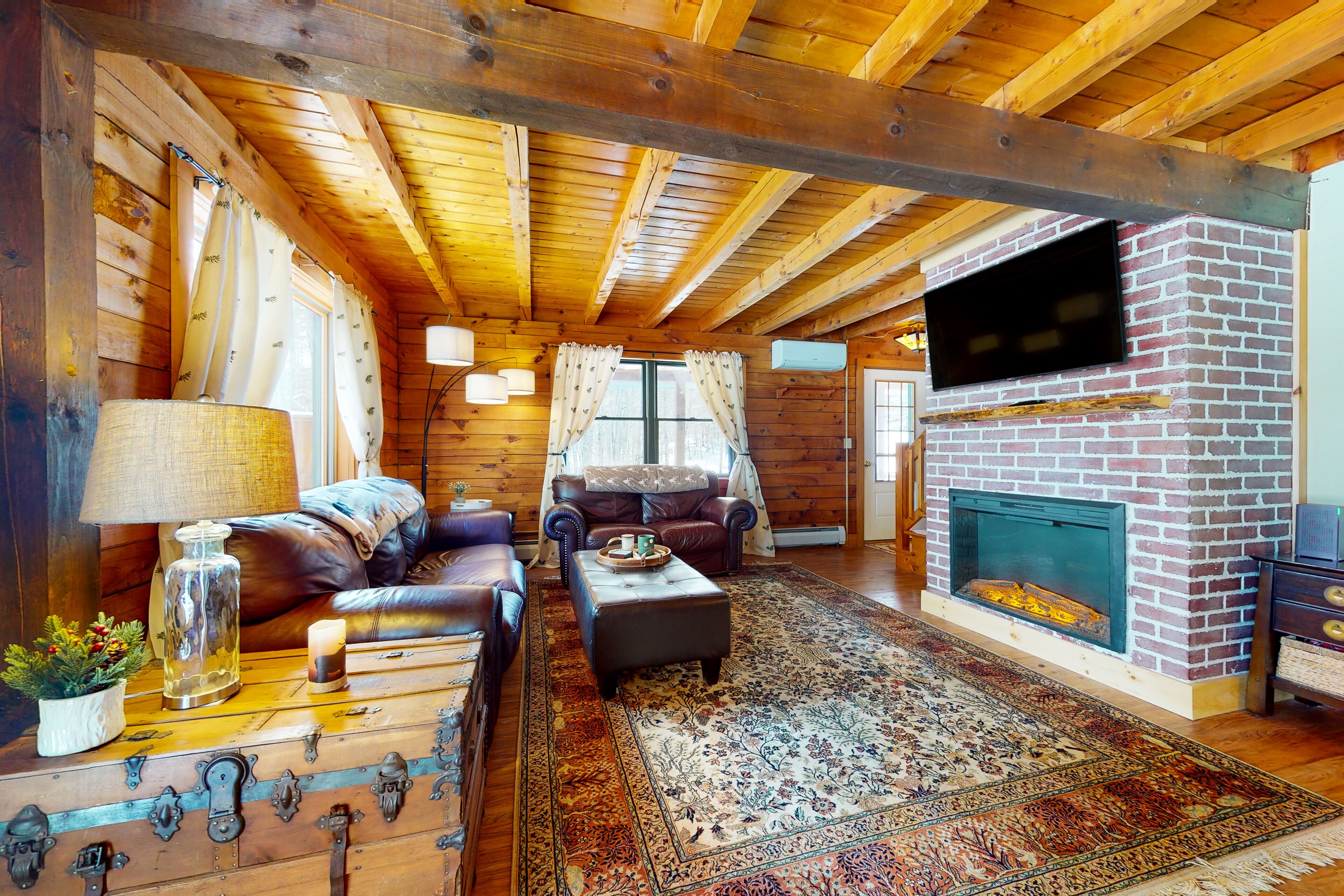 Spacious retreat with private hot tub, game room, deck, fireplace, & W/D